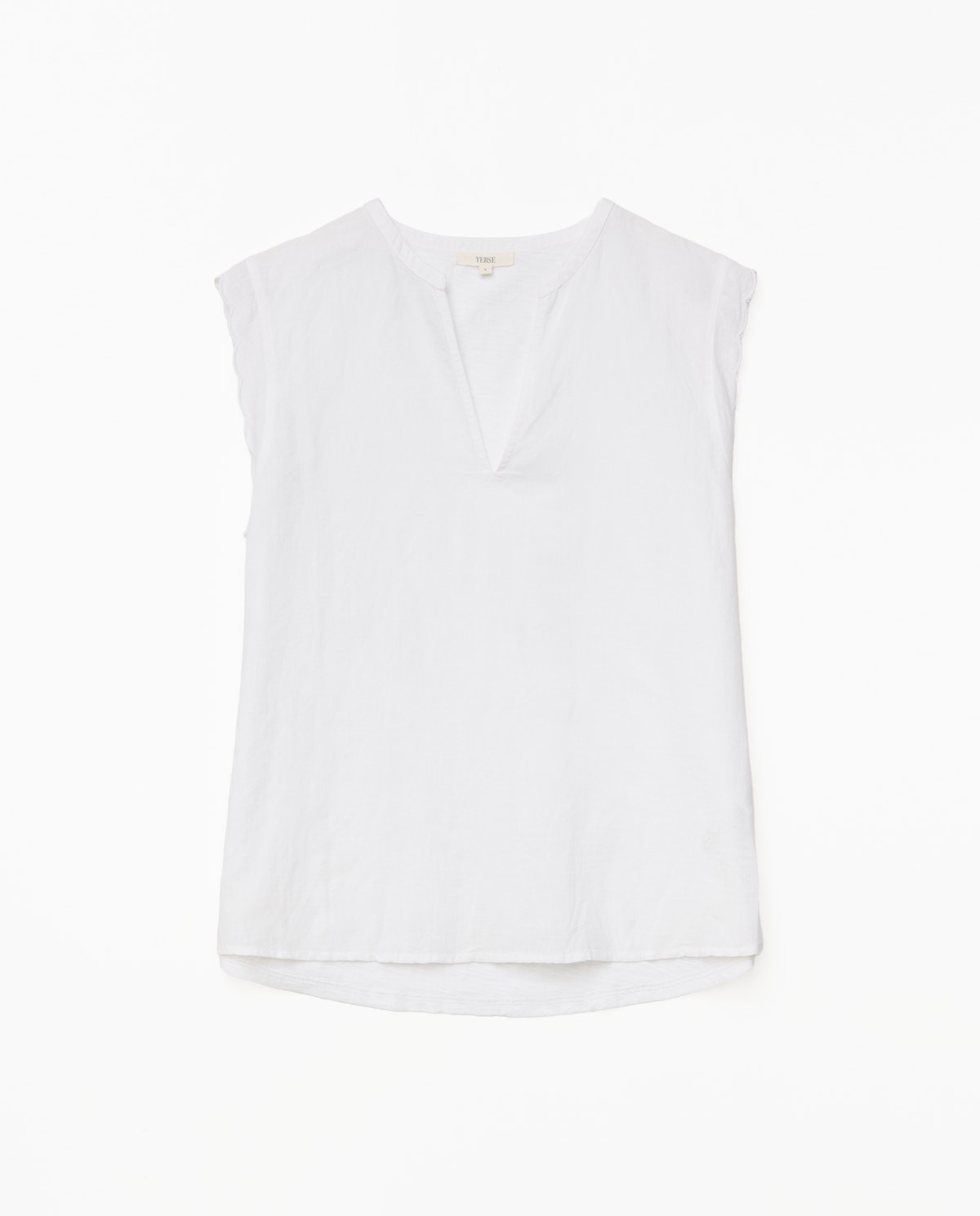 White two-material wave-trim blouse