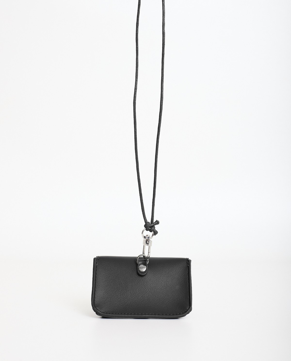 Black rigid mini wallet by Yerse with snap-button closure and removable neck strap 5