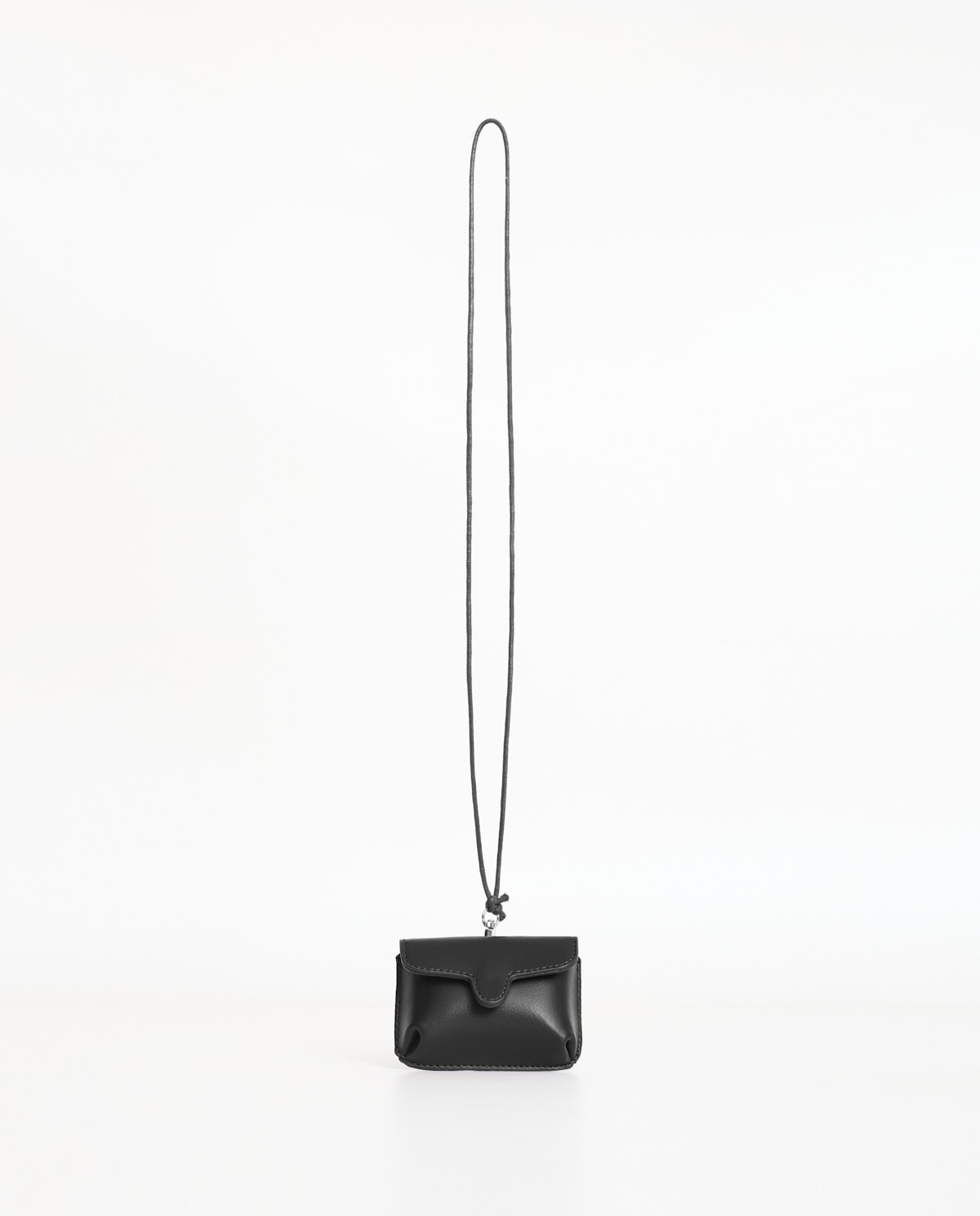Black rigid mini wallet by Yerse with snap-button closure and removable neck strap 6