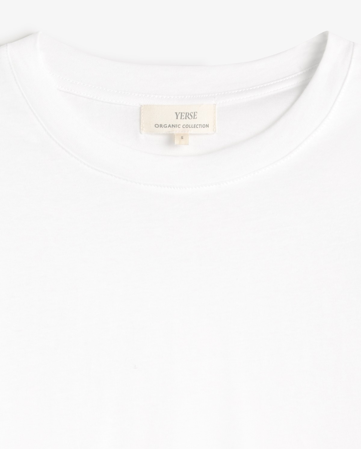 Camiseta algodón orgánico cuello redondo en color blanco, vista frontal con detalle del tejido 8