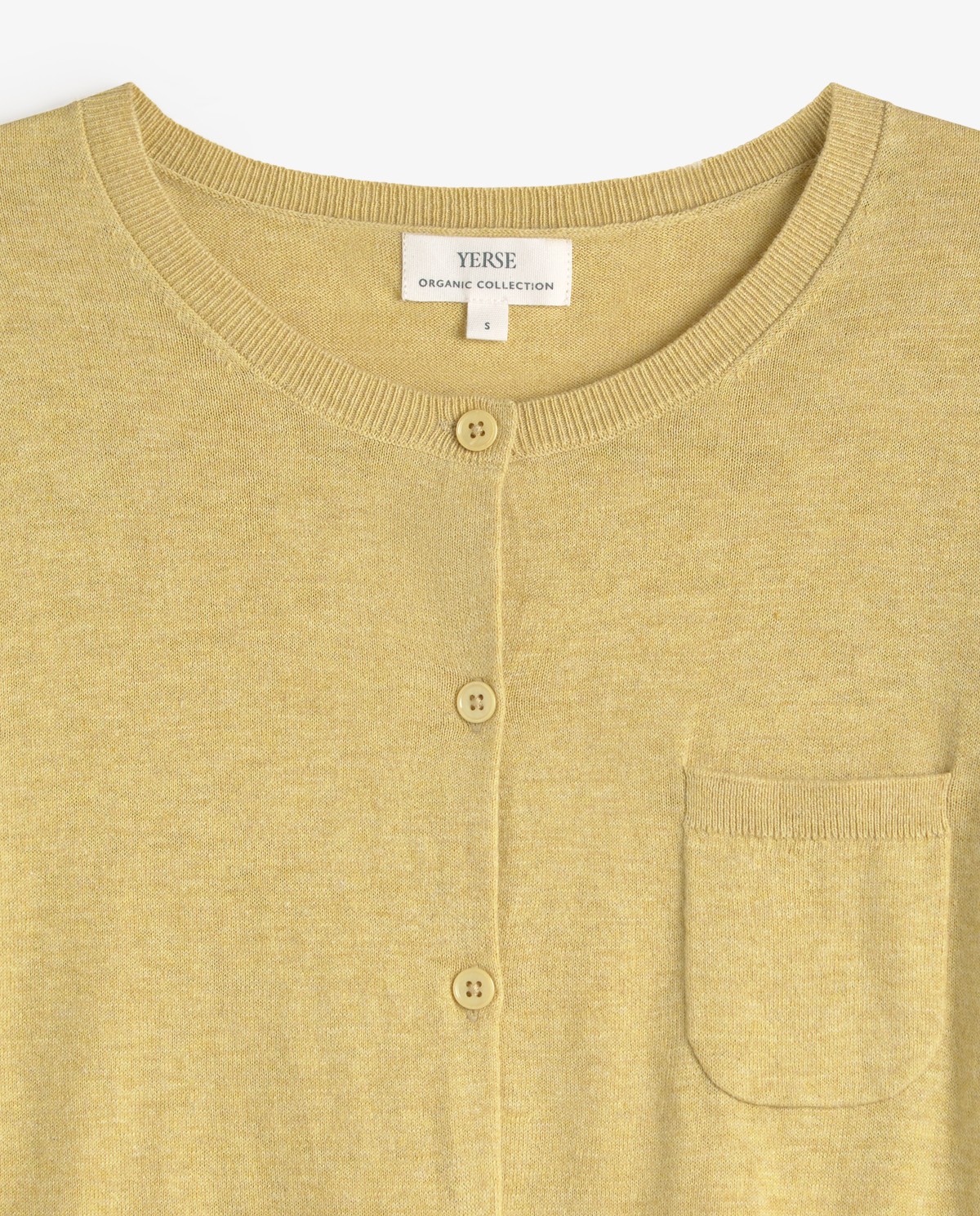 Cárdigan manga larga algodón orgánico en color amarillo, vista frontal con detalle del tejido 7