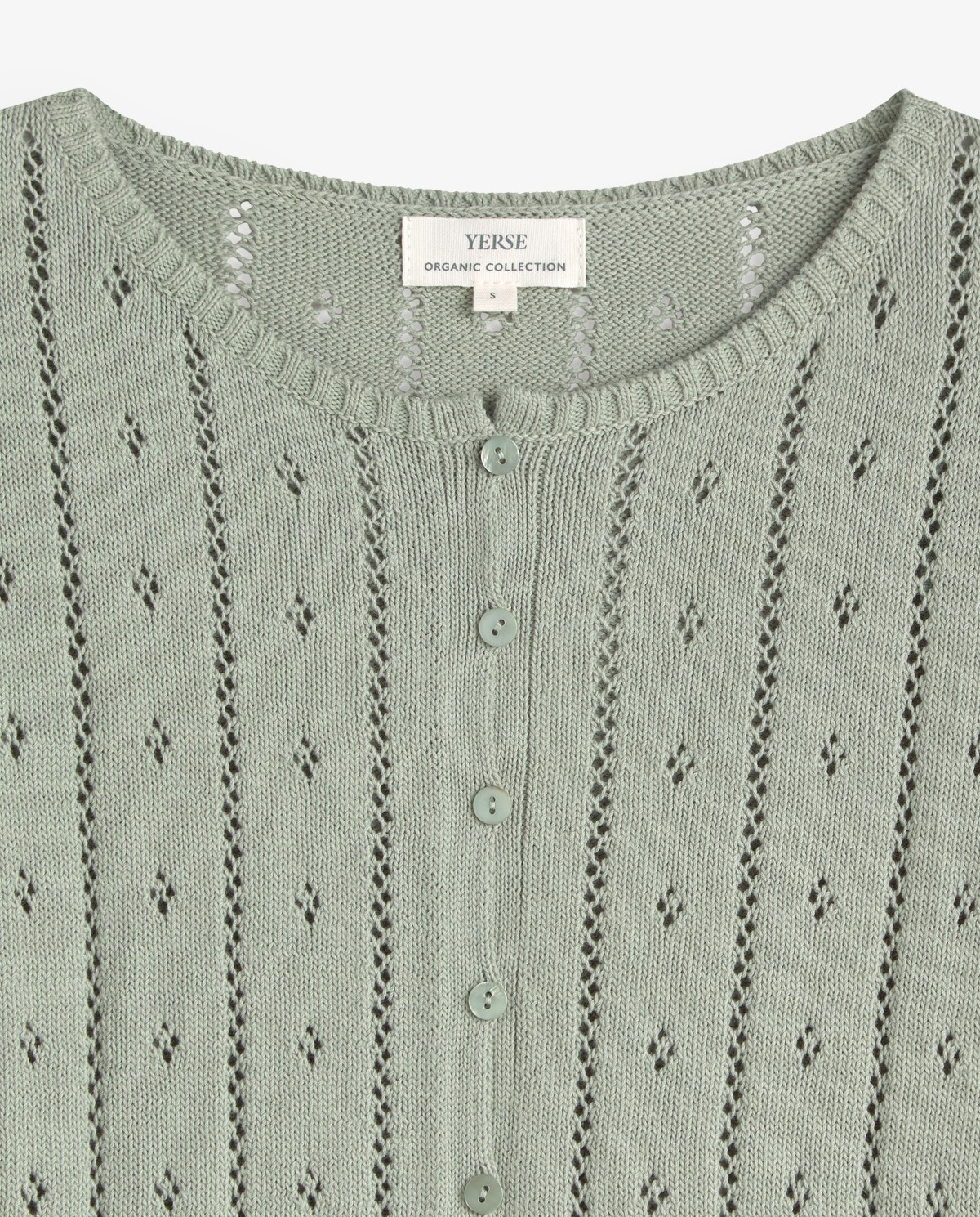 Cárdigan de punto fino calado en color verde, vista frontal con detalle del tejido 5