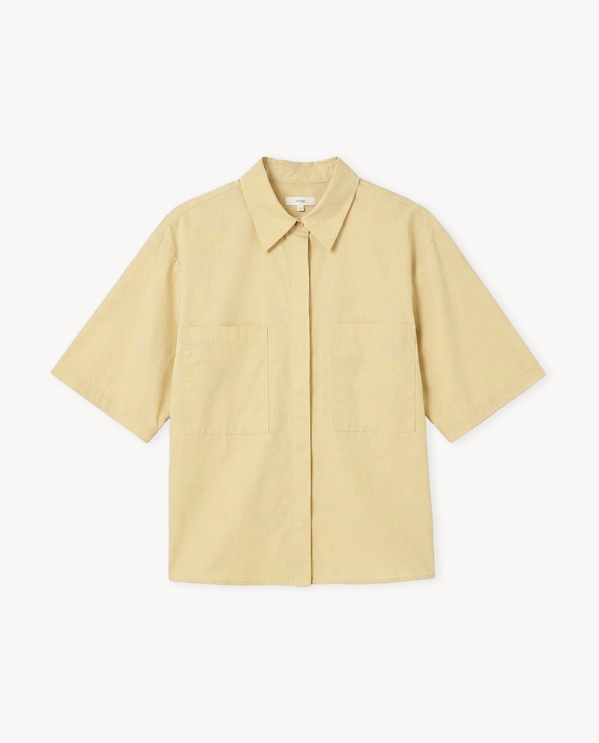Camisa popelí en groc, vista frontal amb detall del teixit 3
