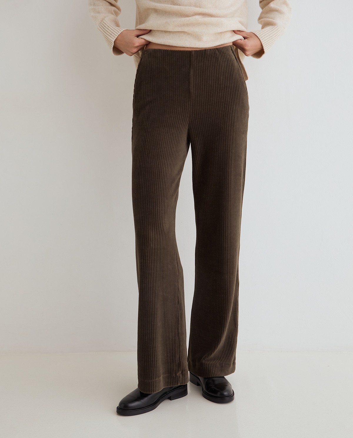 Khaki green wide-leg corduroy trousers, front view with corduroy fabric detail 2