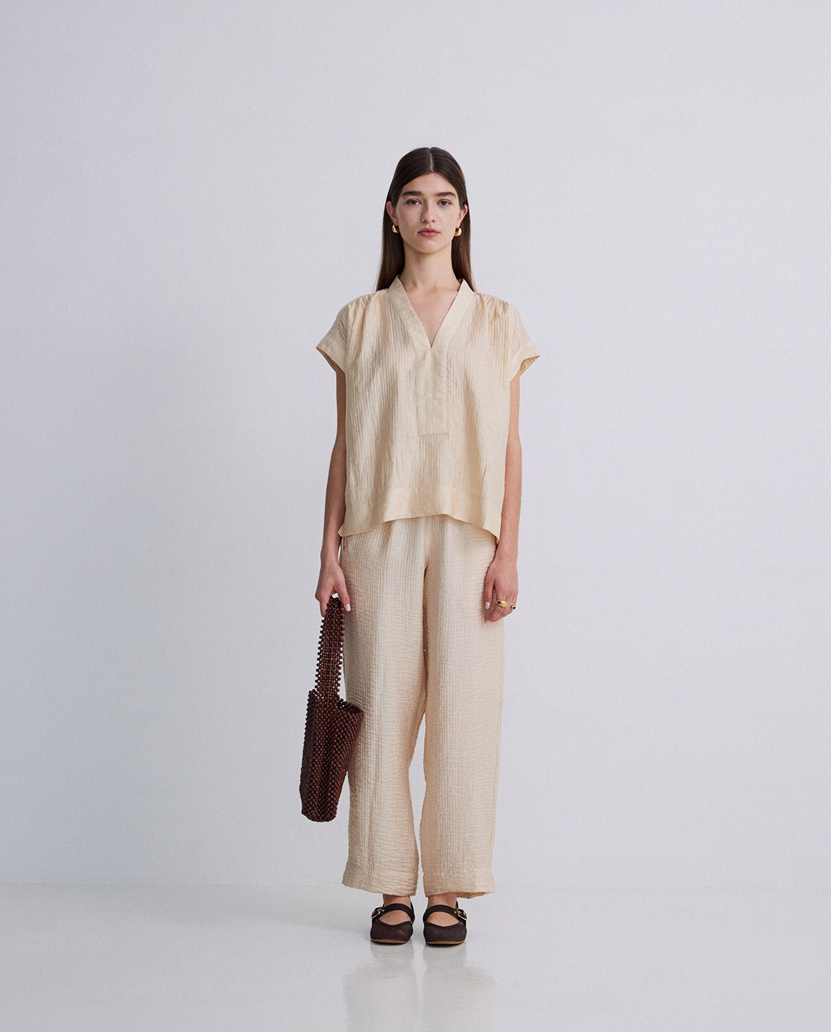 Pantalones wide leg ondulaciones vainilla